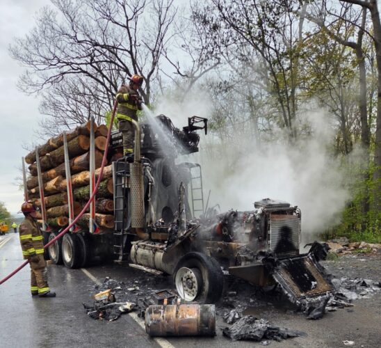 Driver escapes log truck fire on Route 44
